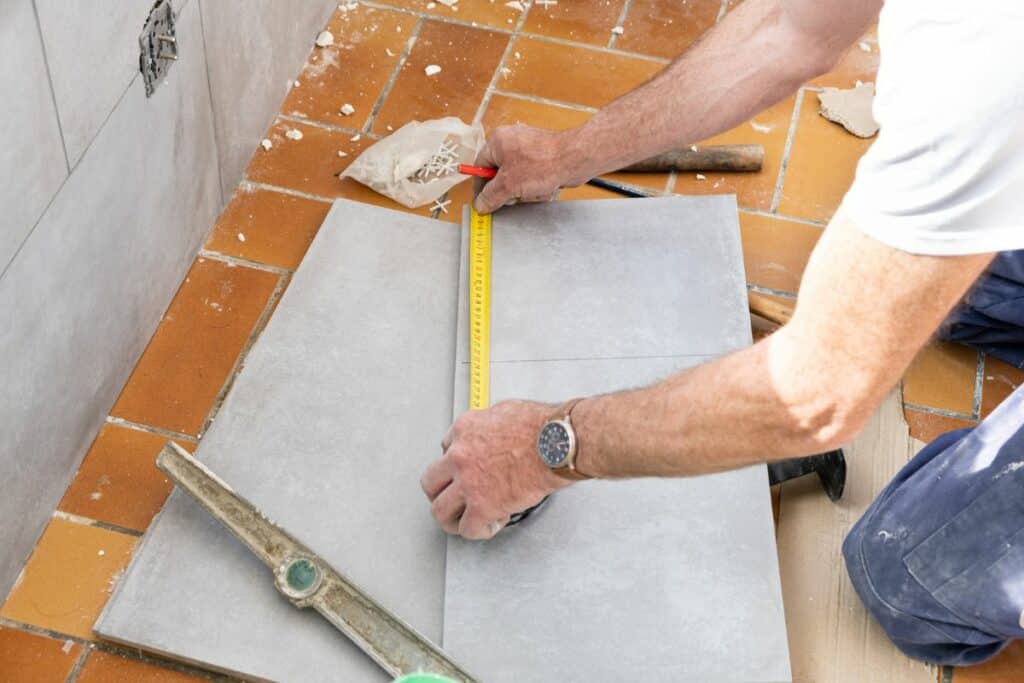 tiler prepping tiles for bathroom renovation
