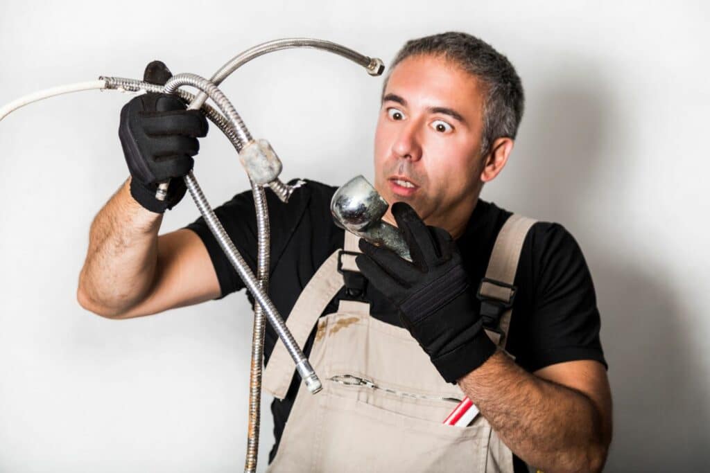 Man with plumbing dilemma looking worried