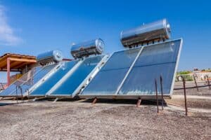 Panels for a solar hot water system seen on the roof of a house.