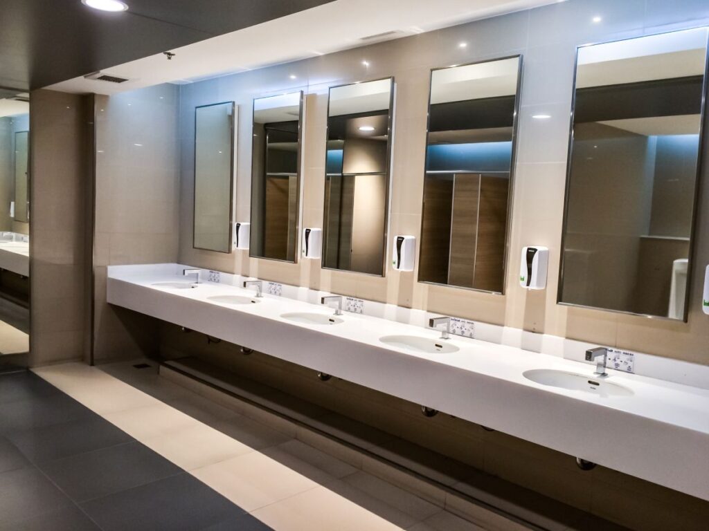 commercial bathroom with handbasins and mirrors